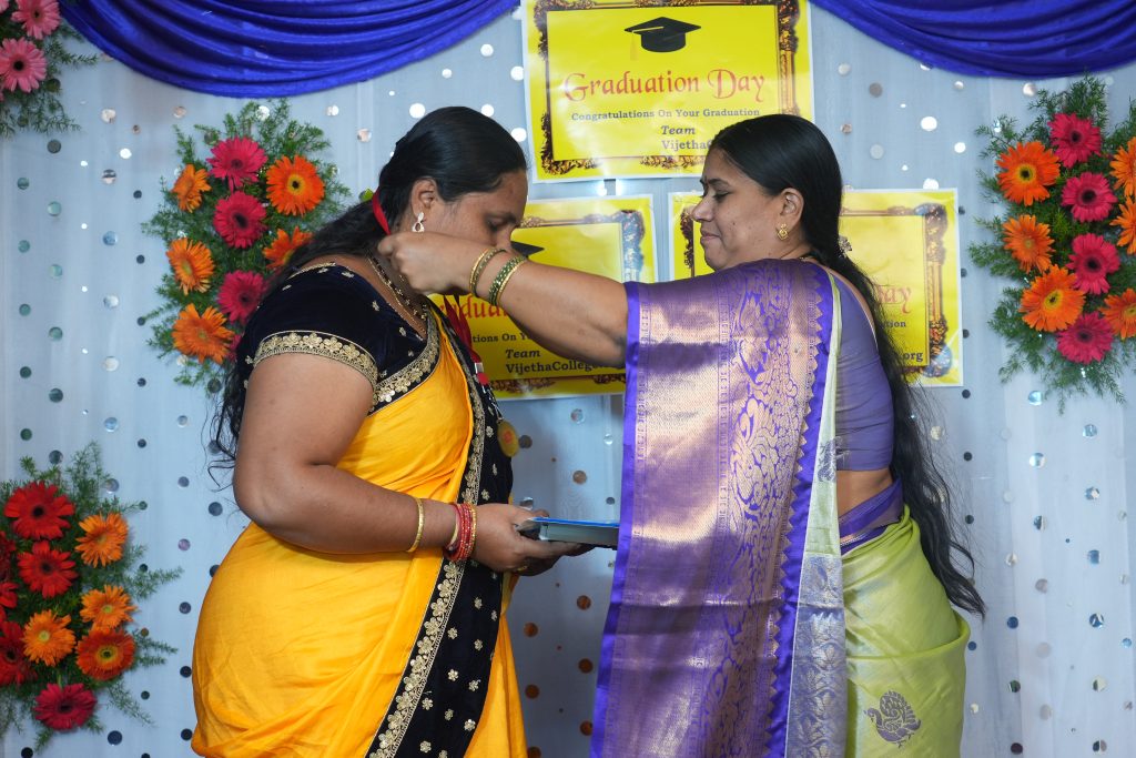 a woman giving a gift to another woman